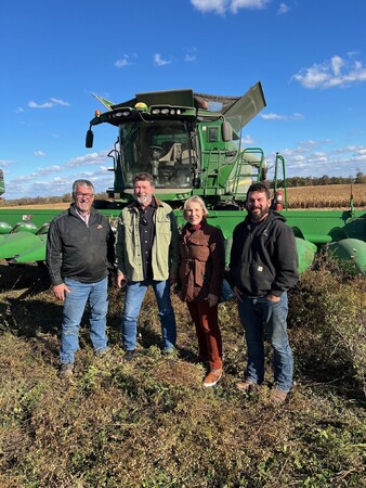 Kane County Board Chairman Corinne Pierog meets with Farmers Steve and Dale Pitstick during a harvest in a cornfield in Hamsphire 
