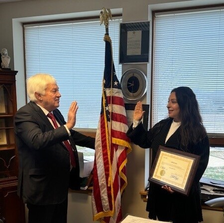 Kane County Clerk Jack Cunningham adminsters oath of office to Dr. Monica Silva t