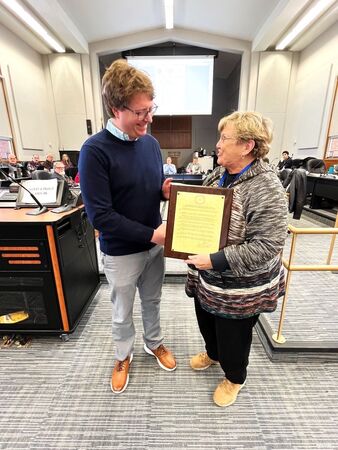 Robert Desio of the Northern Illinois Food Bank accepts the proclamtion from Board Member Cherryl Strathman