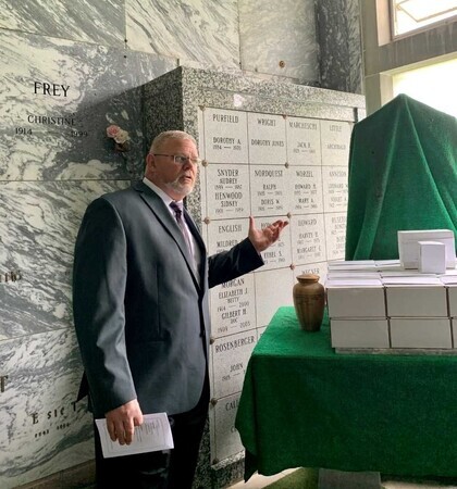 Coroner Rob Russell at memorial service in 2022