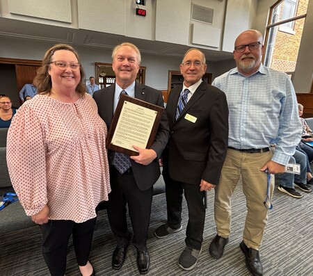 Tracy Erickson, Gary Erickson, Board Member Chris Kious, IT Executive Director Roger Fahnestock 