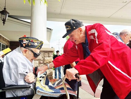 WWII Veteran Norman Rebenstorf celebrated his 99th birthday with fellow WWII Veteran Dick Miller (right/standing), a parade and a city proclamation.