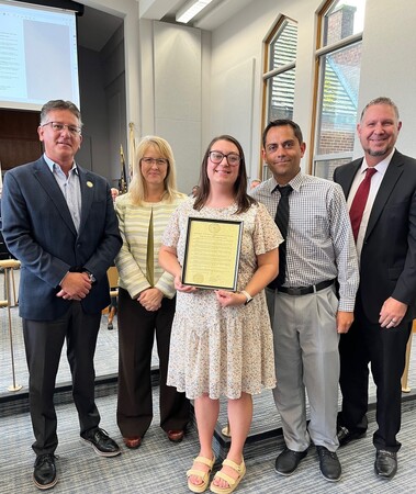 Kim Reed along with Chief Judge Robert Villa, Lisa Aust and fellow staff members