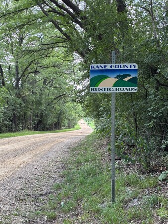 Near Elburn, Pouley Road is known for its dense tree canopy, rolling hills, Blackberry Creek, the historic Pouley Estate and scenic rural vistas.