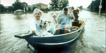 firemen rescue residents from floodwaters on the west side of Aurora during the July 1996 flood