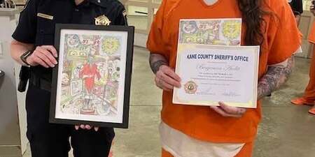 Kane County Undersheriff Amy Johnson with winning artwork