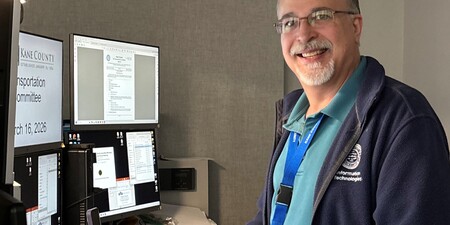 Blair Peters at the IT desk at Kane County