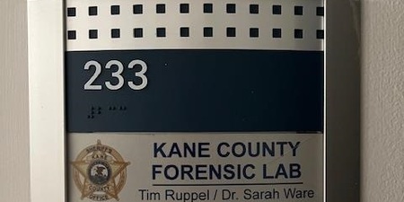 Door placard outside the New Kane County Forensic Lab