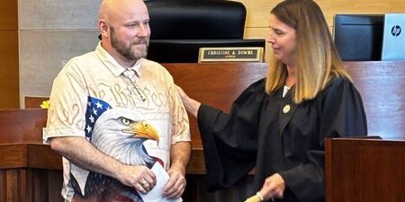 Robert Lundquist with Judge Christine Downs during Veterans Treatment Court graduation 
