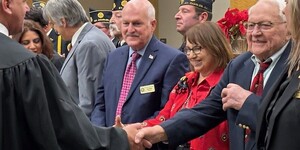 Kane County Board member join in a ceremonial event to take the Oath of Office