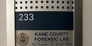 Door placard outside the New Kane County Forensic Lab