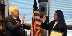 Kane County Clerk Jack Cunningham adminsters oath of office to Dr. Monica Silva t