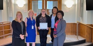 Isabel Ocon pictured in the Center with Court Services Directors and service providers