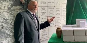 Coroner Rob Russell at memorial service in 2022