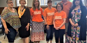 Madam Chair Corinne Pierog stands with members of the Kane Kendall Mothers Demand Action along with County Board Members Myrna Molina (right) and Anita Lewis (left).