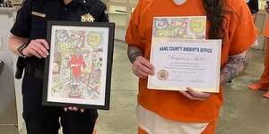 Kane County Undersheriff Amy Johnson with winning artwork 