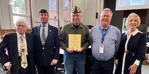 (from left to right) former Board member Ken Shepro, Veterans Anthony Catella and John Westphal, Board member Bill Roth and Board Chair Corinne Pierog