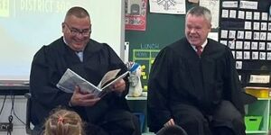 Kane County Chief Judge Clint Hull and Judge Julio Cesar Valdez read to students at Dundee Highlands Elementary School in West Dundee. 