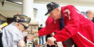 WWII Veteran Norman Rebenstorf celebrated his 99th birthday with fellow WWII Veteran Dick Miller (right/standing), a parade and a city proclamation.