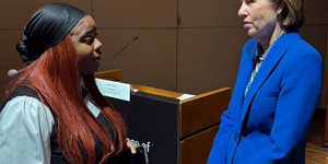 Justice Elizabeth Rochford of the Illinois Supreme Court talks with student. Photo Credit - IJA Instagram 