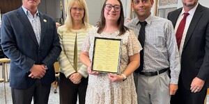 Kim Reed along with Chief Judge Robert Villa, Lisa Aust and fellow staff members