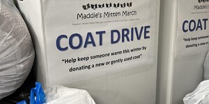 Box full of donations for cold weather clothing drive 