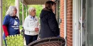 Kane County Board Chairman Corinne Pierog and Volunteer Nancy talk with Meals on Wheel client