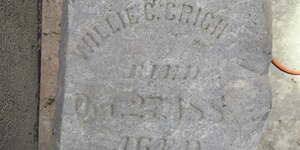 Headstone in the basement of the Third Street Courthouse that reads“Willie C. Cright… , died October 188"